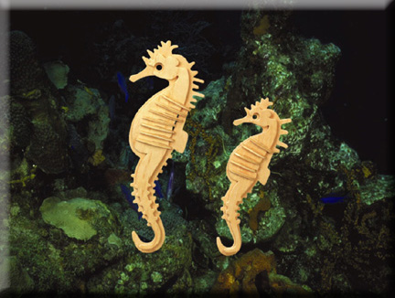 Two freestanding slotted wooden seahorse models in an aquarium display