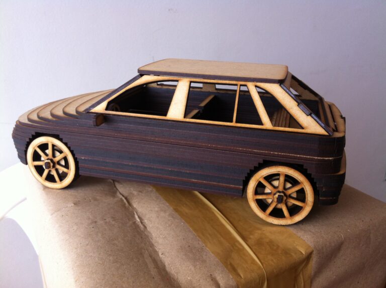 Assembled wooden hatchback car model with layered body and wheels