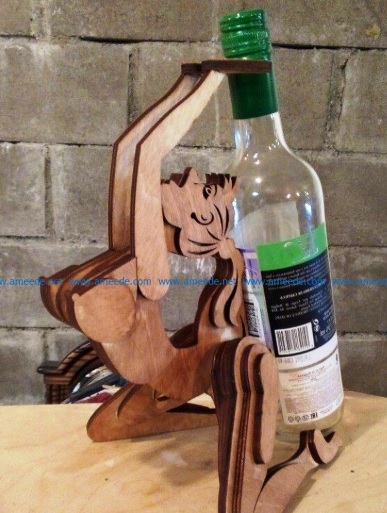 Wooden seated woman silhouette holding a wine bottle
