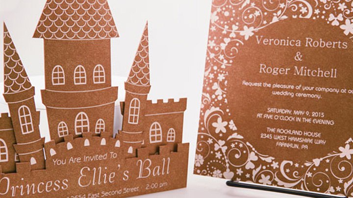Castle-shaped birthday invitation beside floral wedding card