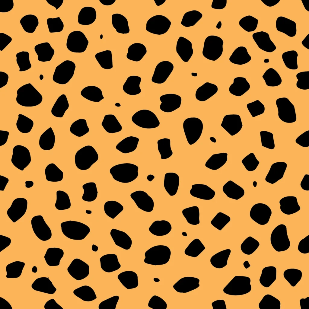 Repeating black cheetah-spot pattern on a warm tan background