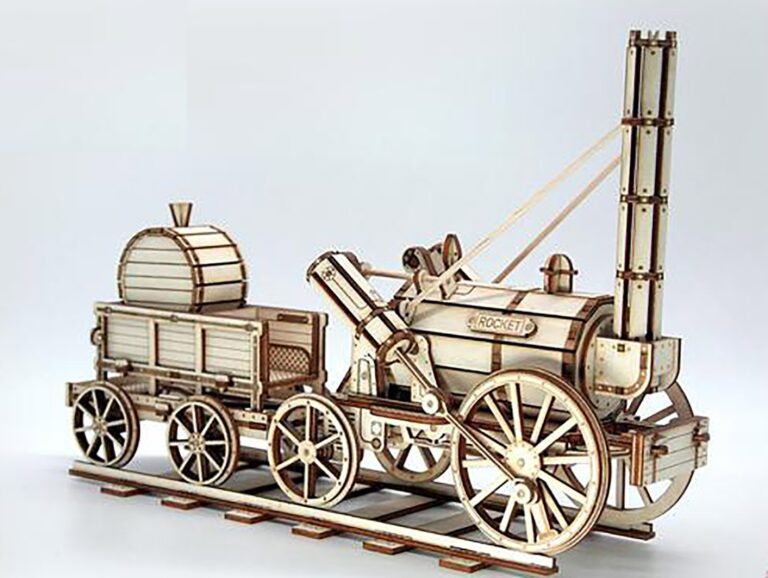 Wooden steam locomotive model with large spoked wheels and a tall chimney