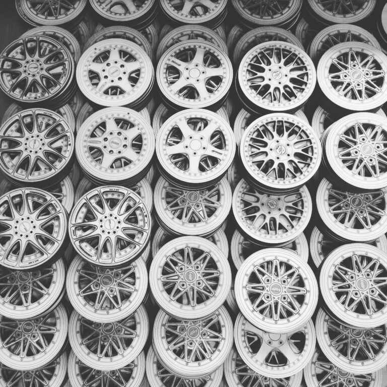 A collection of round wheel-inspired coaster designs with varied spoke-like openings