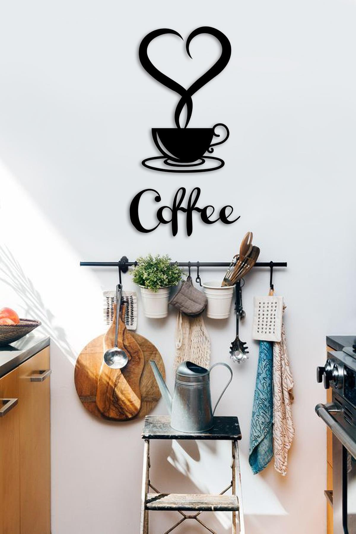 Coffee cup silhouette with heart-shaped steam above Coffee lettering