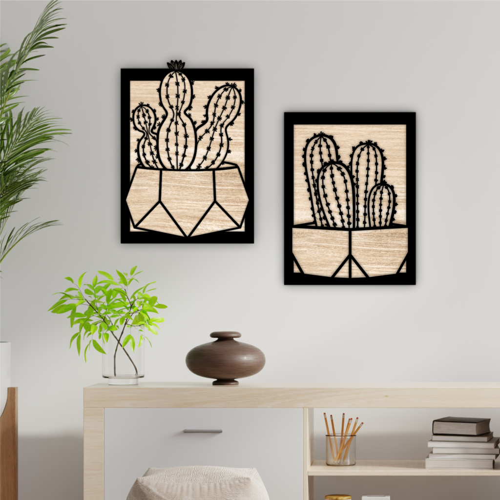Two framed cactus silhouette wall panels above a cabinet