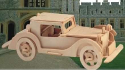 Photographed wooden model of a 1930s Auburn-style automobile