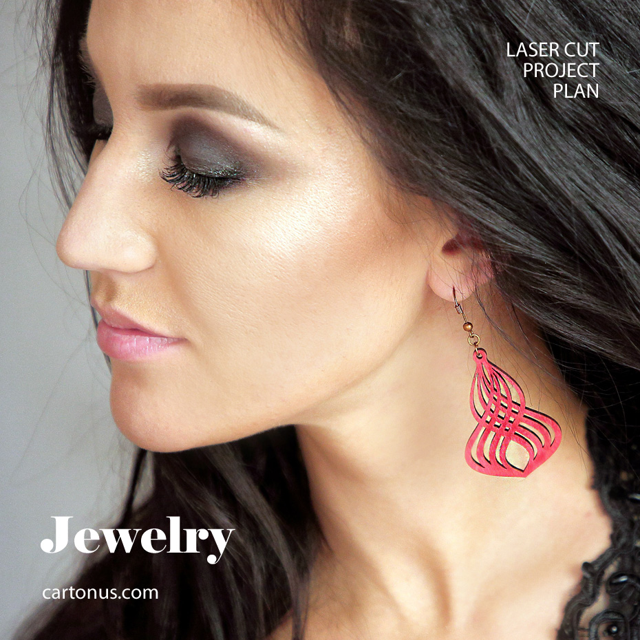Woman wearing a pink curved filigree earring in the supplied jewelry reference